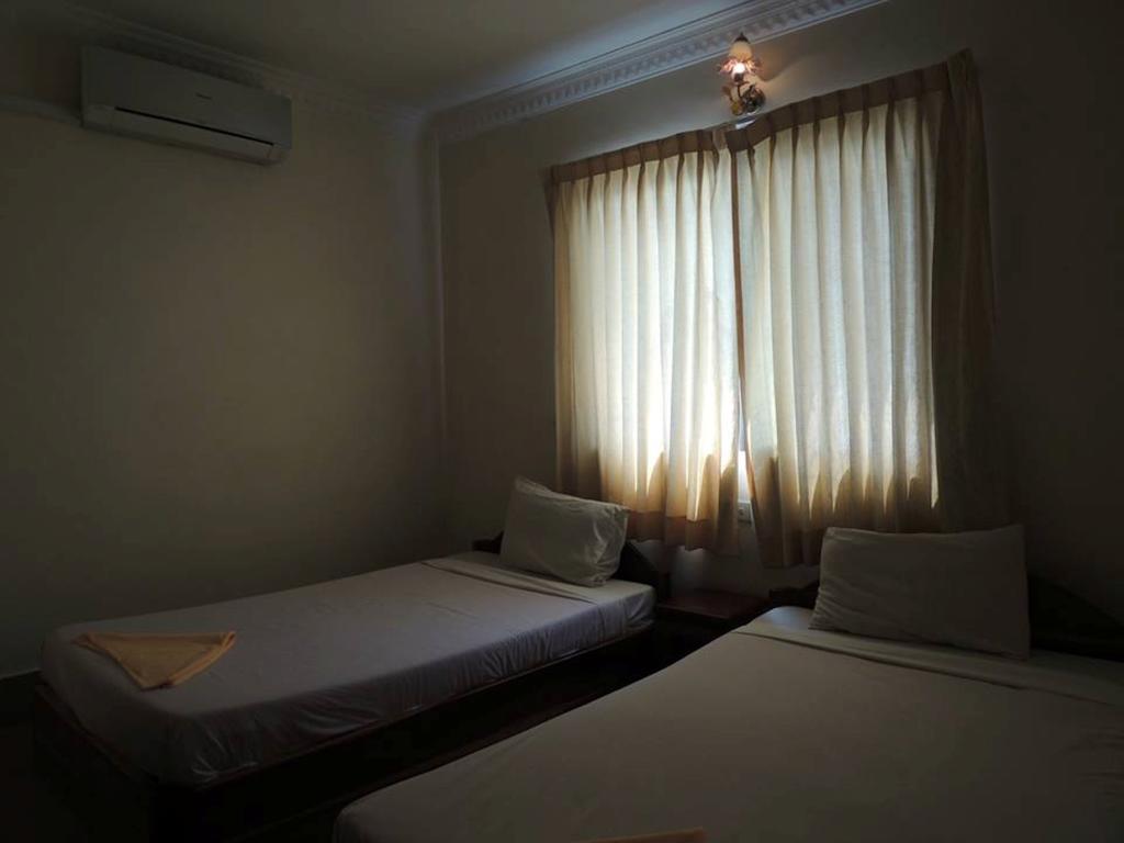 Shang Hai Guesthouse Battambang Rum bild